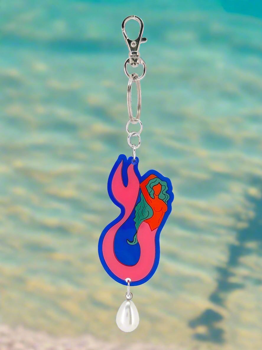 Colorful keychain with a blue and pink design on a white background