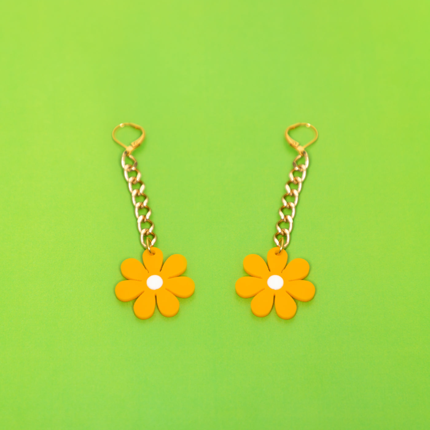 The Baby Daisy Chain Earrings: Gold chain and canary daisy.